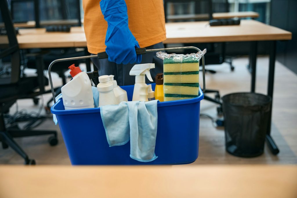 Cleaning service employee uses special set gadgets for cleaning and disinfection