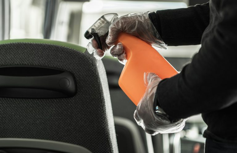 Coach Bus Owner Sanitizing and Cleaning Vehicle Seats